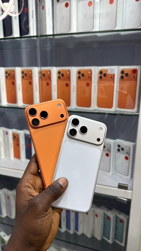 Genuine orange and silver iPhones held together at the Valmont counter