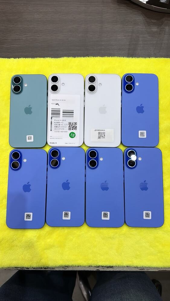 Eight blue and white iPhone 13 and 14 units laid out