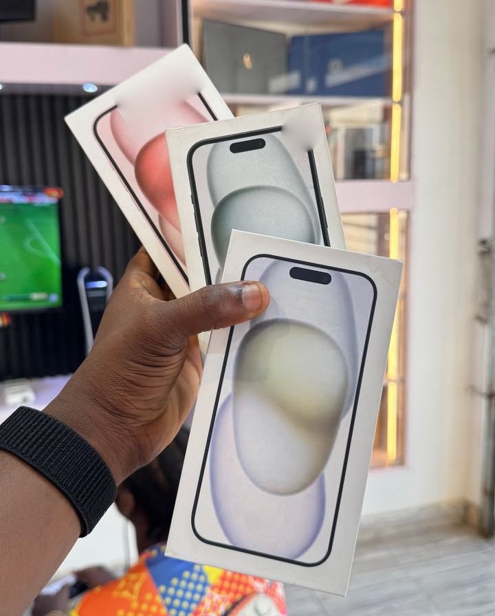 Boxed iPhone 15 128GB held in hand inside Valmont Gadgets Circle store