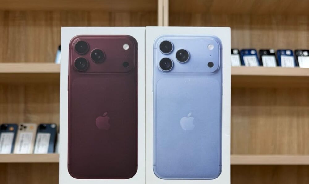 Sealed iPhone 18 Pro Max 256GB boxes in burgundy and blue on the Valmont Gadgets counter in Accra
