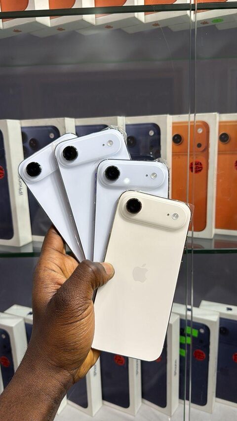 Silver and white iPhones in hand at the Valmont store